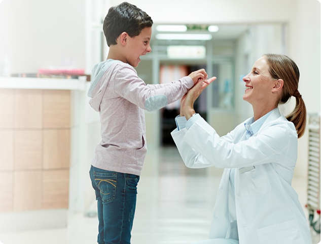 An eye care professional examining a child's eyes